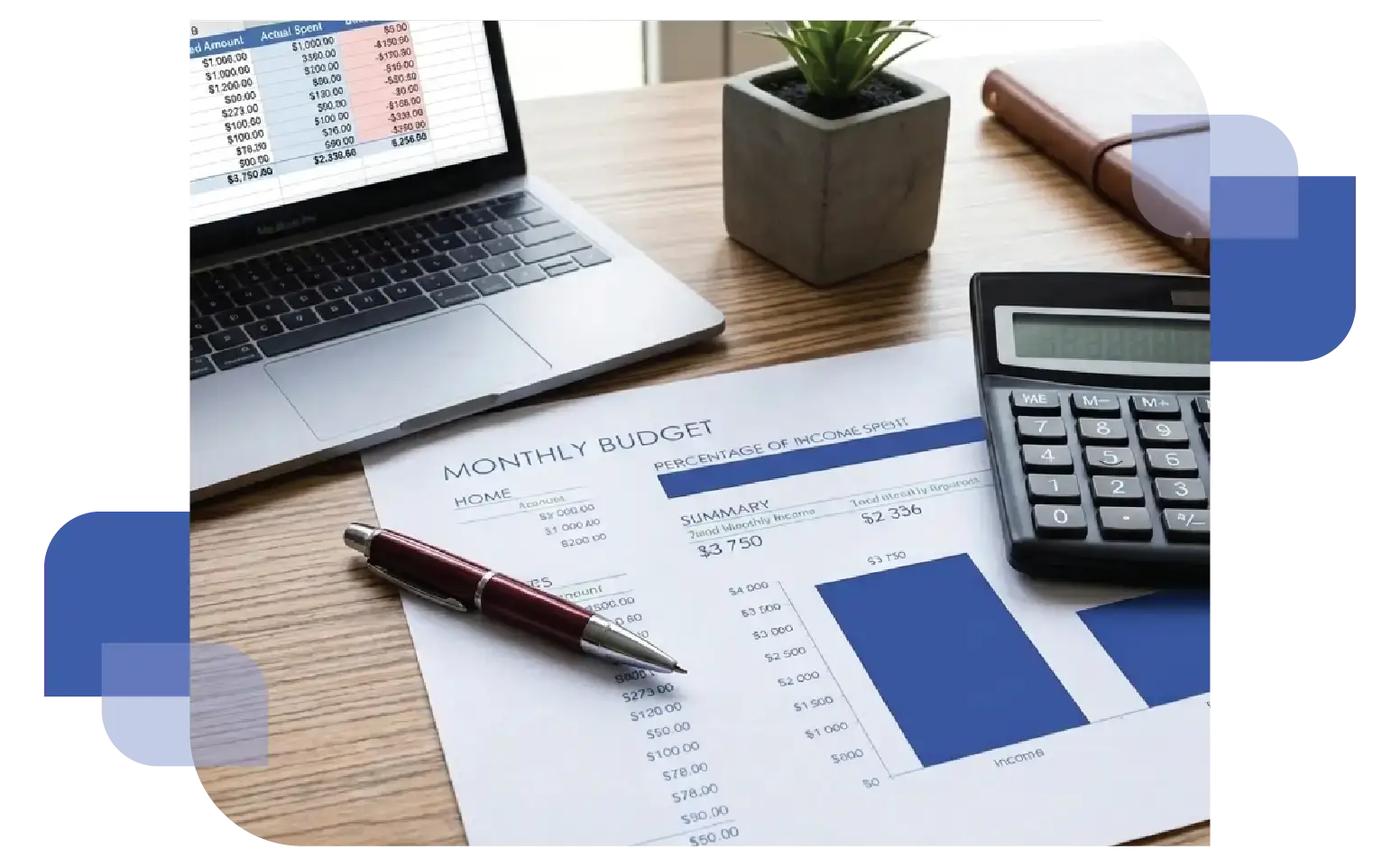 A wooden office desk with a calculator and pen resting on top of a "Monthly Budget" financial document and a computer monitor with a colorful graph representing cost-effective energy planning.